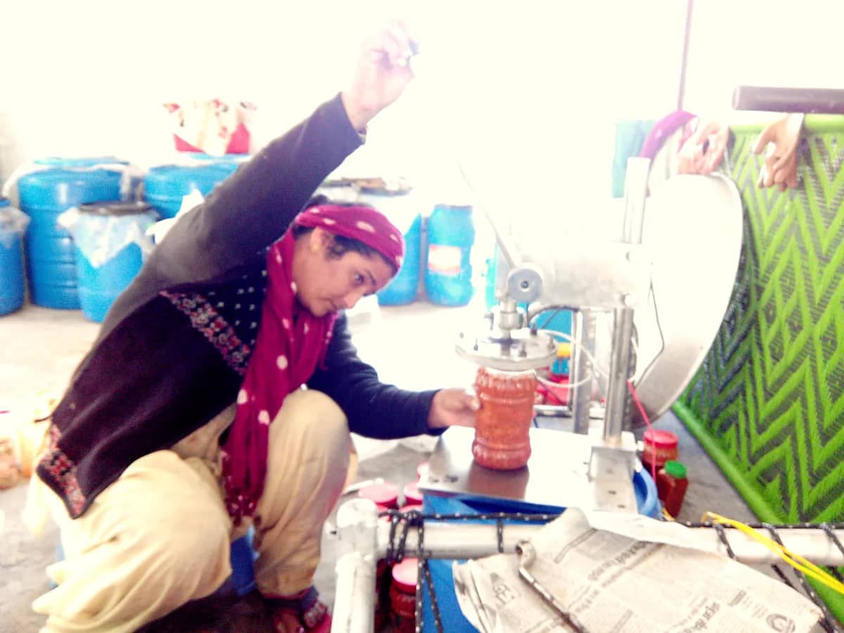 Filling sharbat bottles one at a time